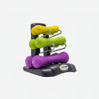Set of colorful dumbbells on a black stand against a white background