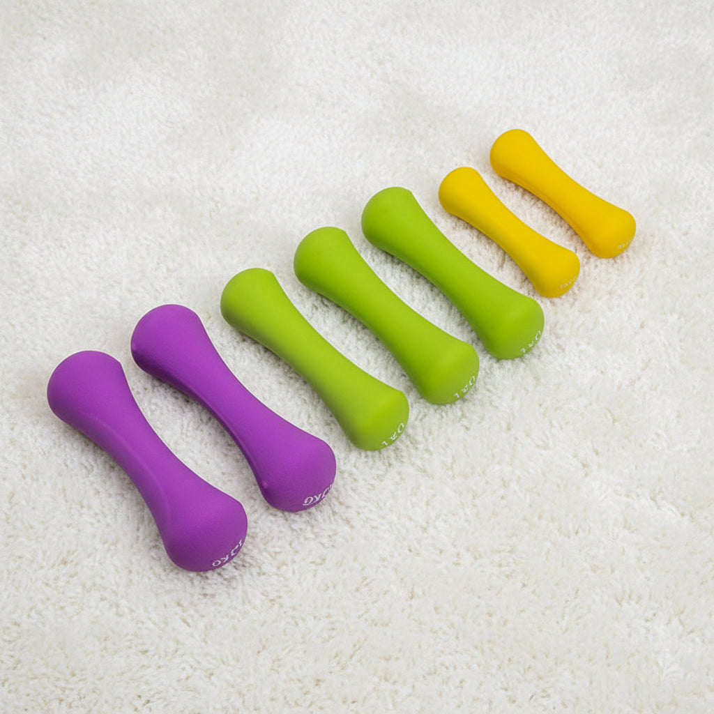 Set of colorful dumbbells on a white background