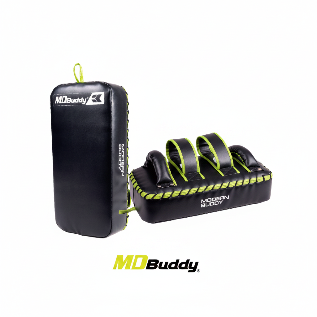 The MD Buddy Kick Shield is a lightweight yet sturdy training tool designed for martial arts like MMA, Muay Thai, Krav Maga, and kickboxing. Its 40 × 20 × 10 cm strike pad provides a wide, stable target area for practicing kicks with comfort and precision. Strategically placed handles and adjustable straps ensure a secure, ergonomic fit on the forearms, allowing trainers and partners to hold it easily during intense sessions. Made from durable PVC and EPE materials, this kick shield withstands repeated stri