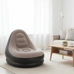 An inflatable camping chair seat pad in a taupe-beige color with a black inflatable base, shown against a plain white background.