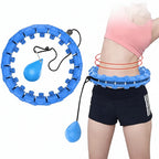 Blue hula hoop with weight loss bands around a person's waist