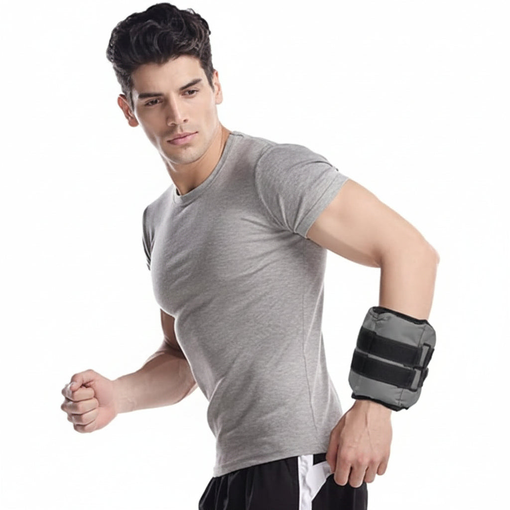Man wearing a gray t-shirt and black arm brace on a white background