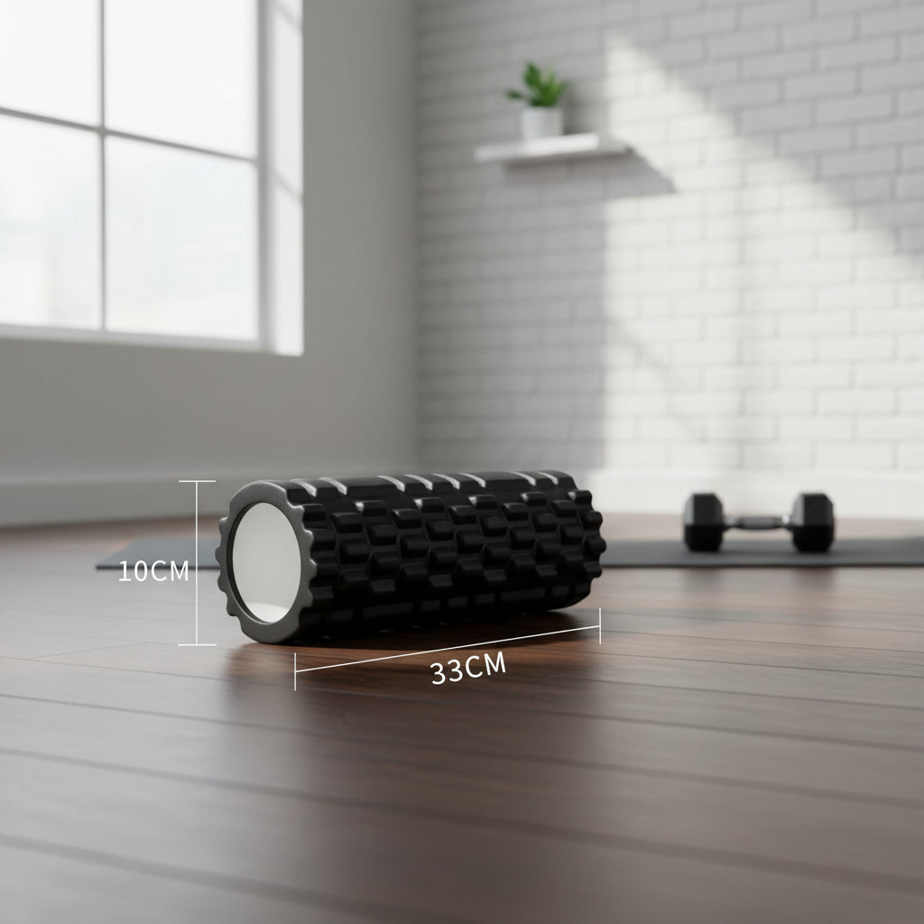 Black foam roller with measurements on a white background