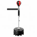 Black and red punching bag with stand on a white background