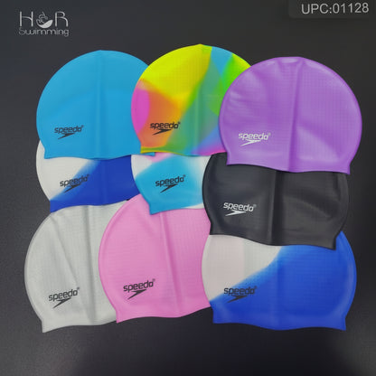 A set of Speedo swim caps displayed in multiple colors on a dark background, including blue, pink, purple, black, white, and a neon multicolor gradient cap.