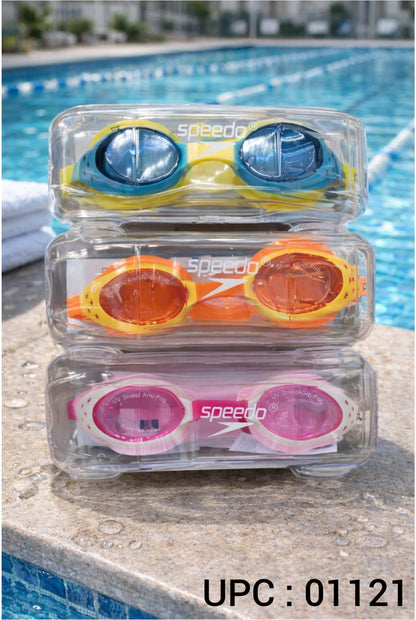Three pairs of Speedo swim goggles stacked in clear plastic cases on a poolside ledge, with blue water and a blurred pool background.