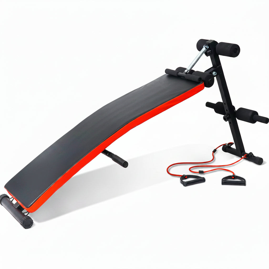 An incline abdominal exercise bench with a black padded surface and red trim, 