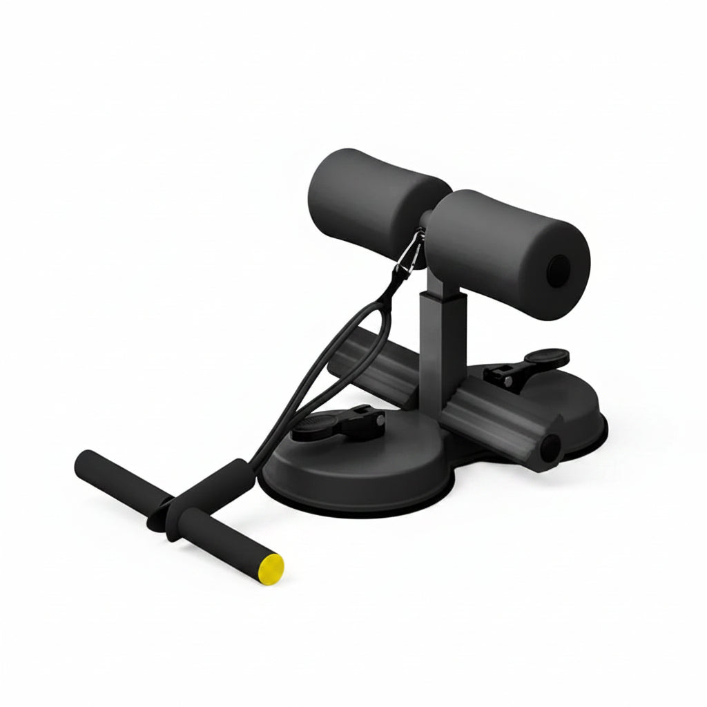 A black foam exercise device with suction cup base and a T-bar handle with a yellow accent, shown on a light wood floor in a bright room.