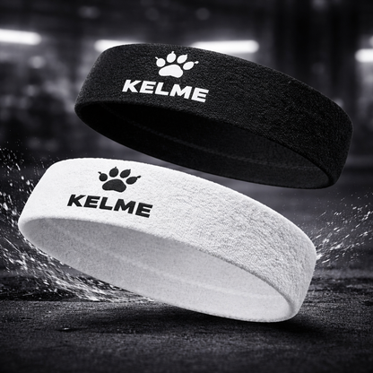 Two athletic headbands floating in a dark, smoky environment: one black with a white paw print and KELME logo, and one white with a black paw print and KELME logo.