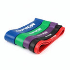 Four MDBuddy resistance bands in blue, green, purple, black, and red,