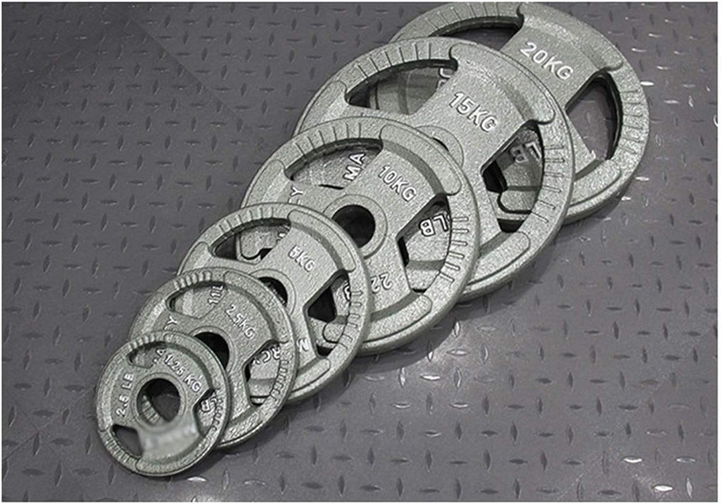 Set of weight plates with labeled weights on a textured surface