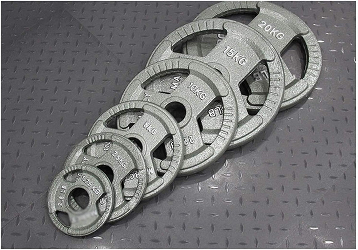 Set of weight plates with labeled weights on a textured surface