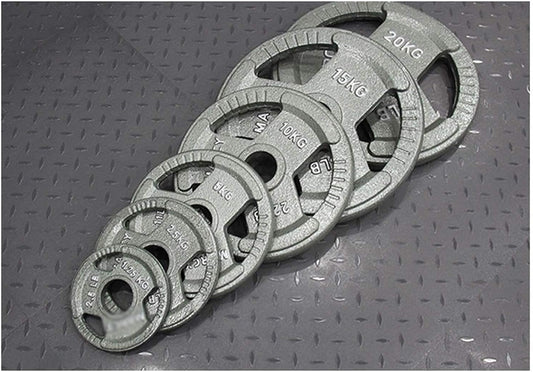 Set of weight plates with labeled weights on a textured surface