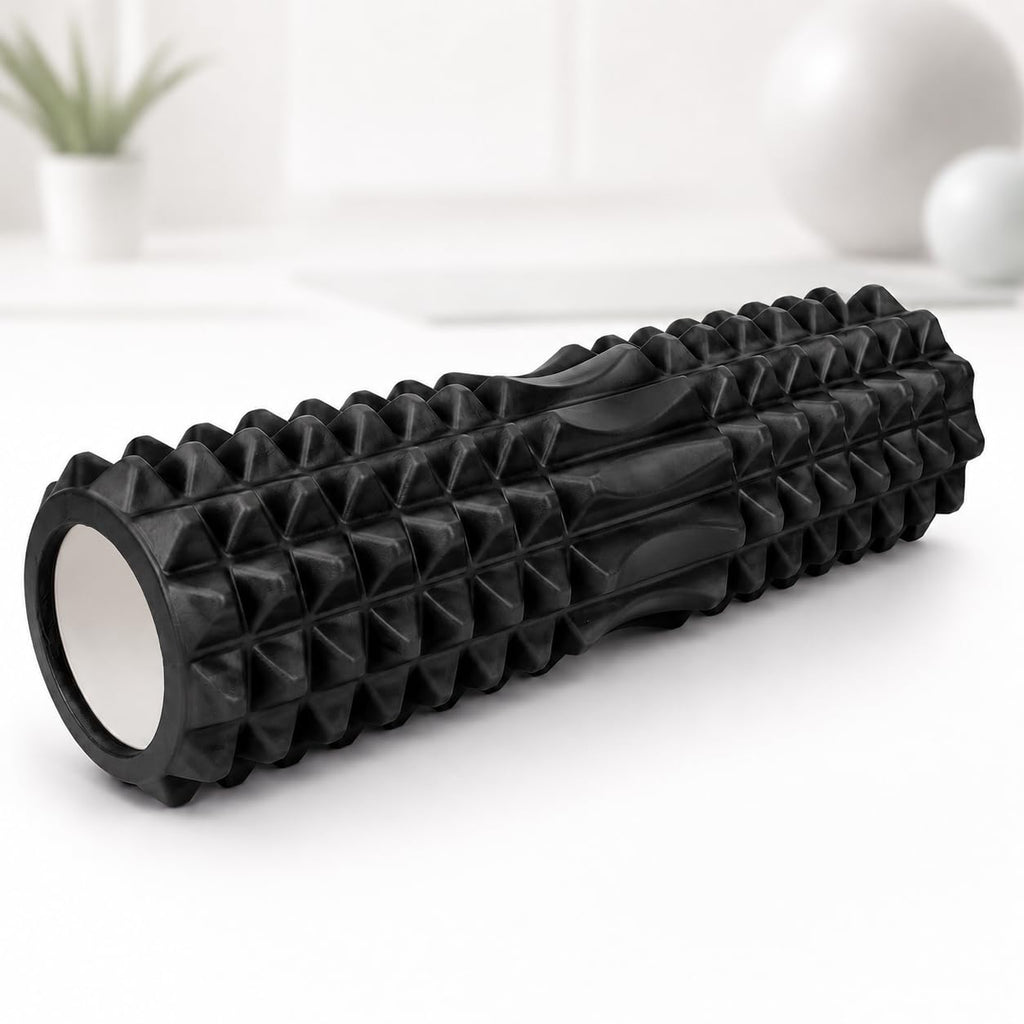 A black textured foam roller with a ribbed and pyramid-patterned surface, 