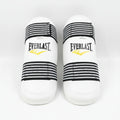 A pair of Everlast boxing shin guards in white with black and white striped elastic