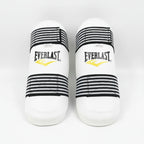 A pair of Everlast boxing shin guards in white with black and white striped elastic