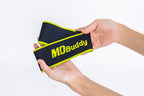 A pair of black wrist wraps with bright yellow trim and the brand name 'MD Buddy' printed in yellow