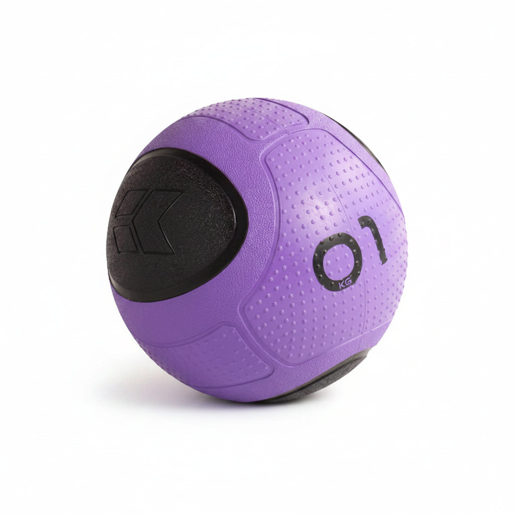 A purple and black medicine ball with a textured surface, featuring a black logo on one side 