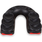 Black finger exerciser with red ends on a white background