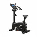 Black exercise bike with digital display on a white background