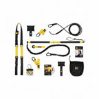 TRX training system components including straps, anchors, and manual on a white background