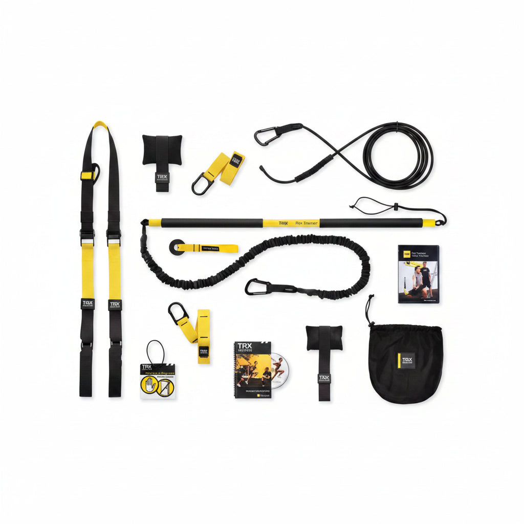 TRX training system components including straps, anchors, and manual on a white background