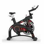 Black and red exercise bike on a white background