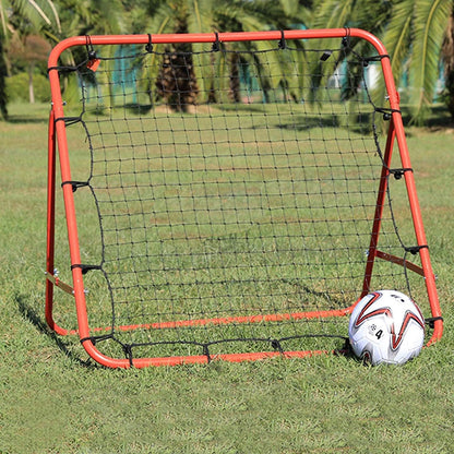 Soccer goal with a ball on a grassy field
