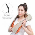 neck and shoulder massager with car adapter on a couch