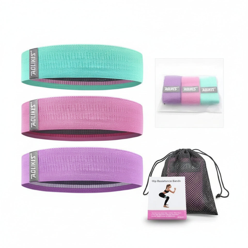 Set of resistance bands in green, pink, and purple with a drawstring bag on a white background.