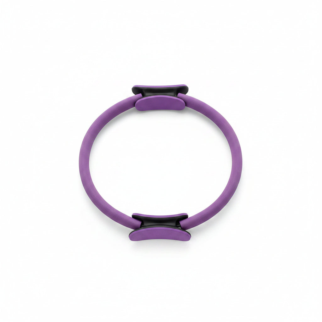 Purple Pilates ring with black clips on a white background