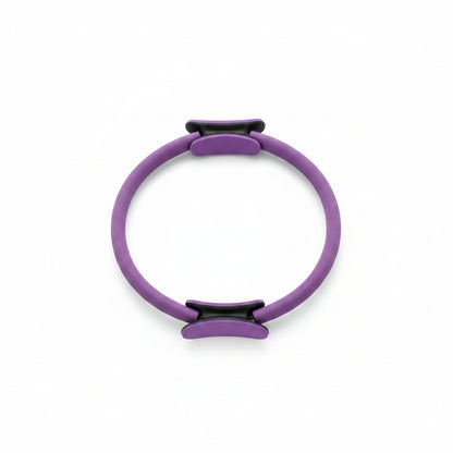Purple Pilates ring with black clips on a white background