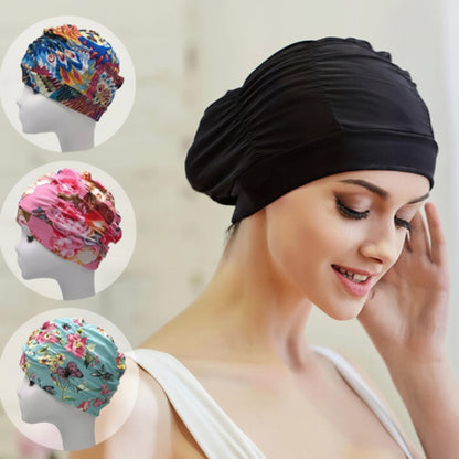 Woman wearing a black headscarf with inset images of colorful headscarves on mannequins.