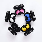 Black cases with colorful inserts arranged in a circular pattern on a white background