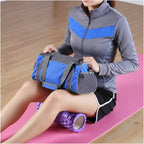 Person using a purple foam roller on a pink mat