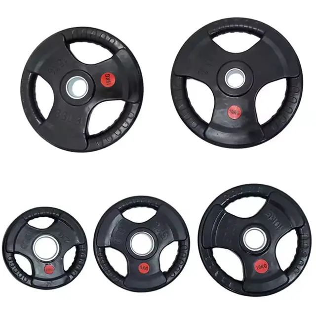 Five black rubber weight plates in different sizes arranged on a plain white 