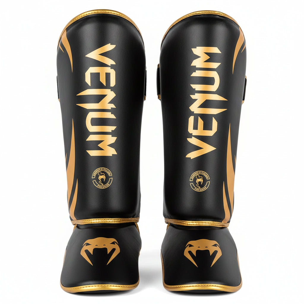 Black and gold Venum shin guards 