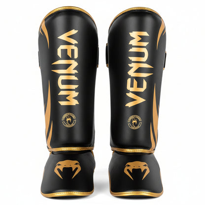 Black and gold Venum shin guards 