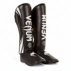 Pair of black Venum shin guards \brothersshop