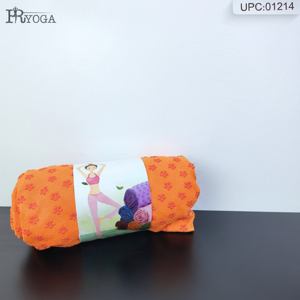An orange yoga mat rolled up and wrapped 